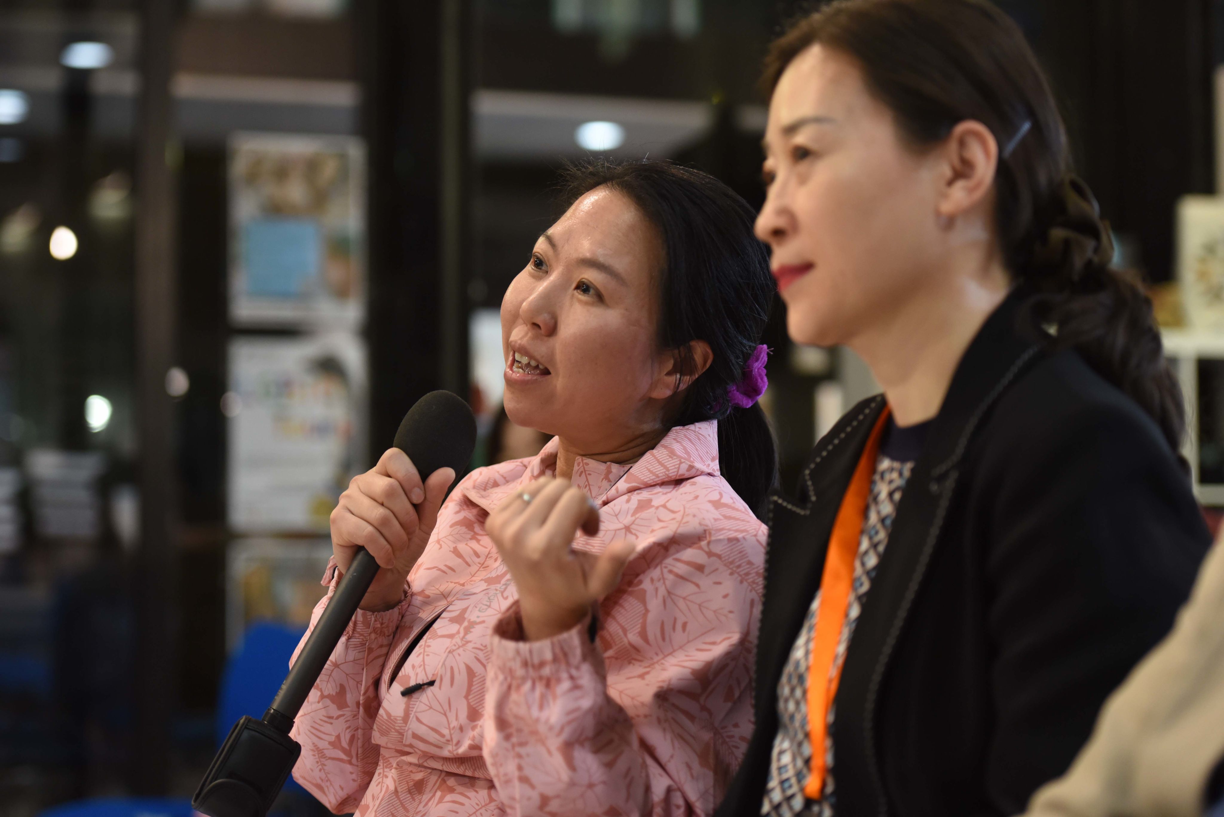 Audience members asking questions